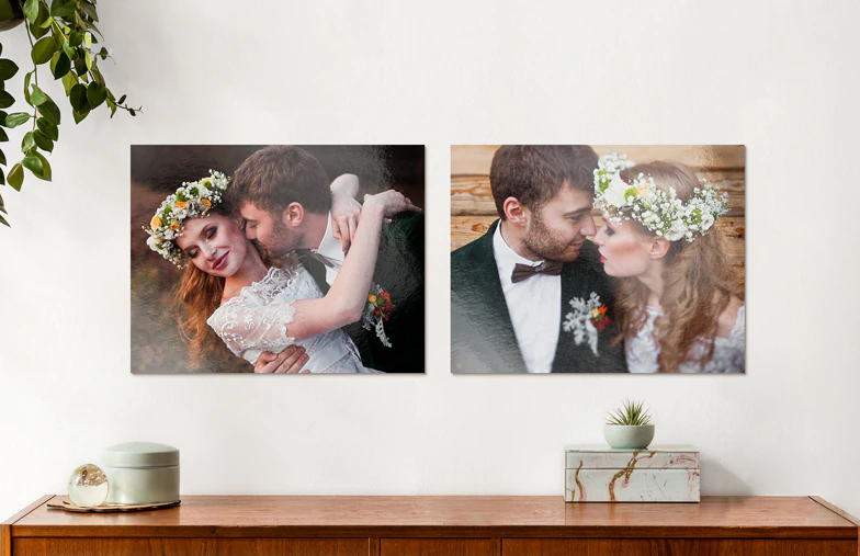 Metal Photo Print by Printerpix|Aluminium photo print of a moutain and a lake being held by woman made by Printerpix|Small square metal print of man diving into lake|Metal photo print of mom and daughter on bookshelf|Woman placing metal print of girlfriend and boyfriend on wall|Three metal photo prints of mixed sizes|||||