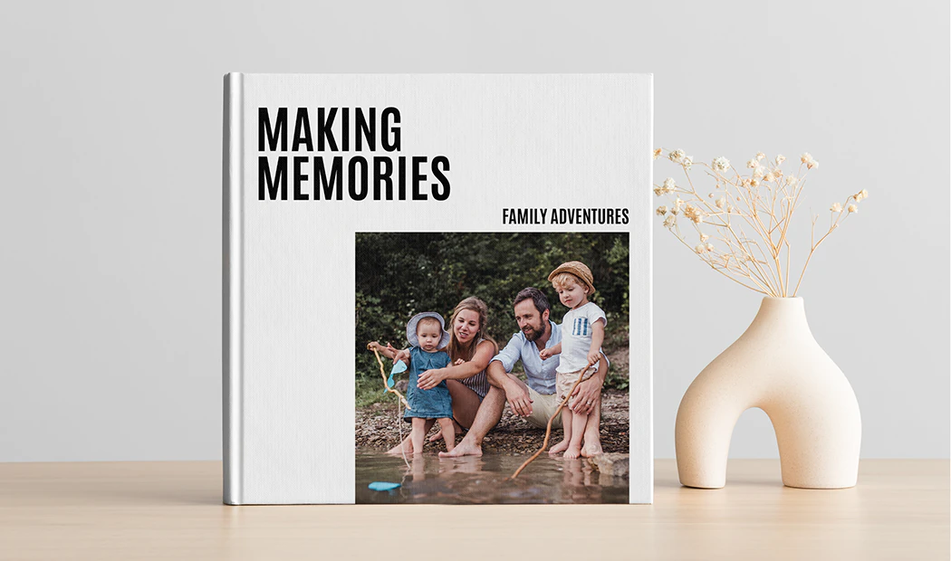 Photo Books|Photo Books|Personalised photo album book with romantic pictures of a couple and photo cover|Family photo album with custom printed cover and family name text|Pet and woman looking at personalised family photo book with custom design|HardCover|||||