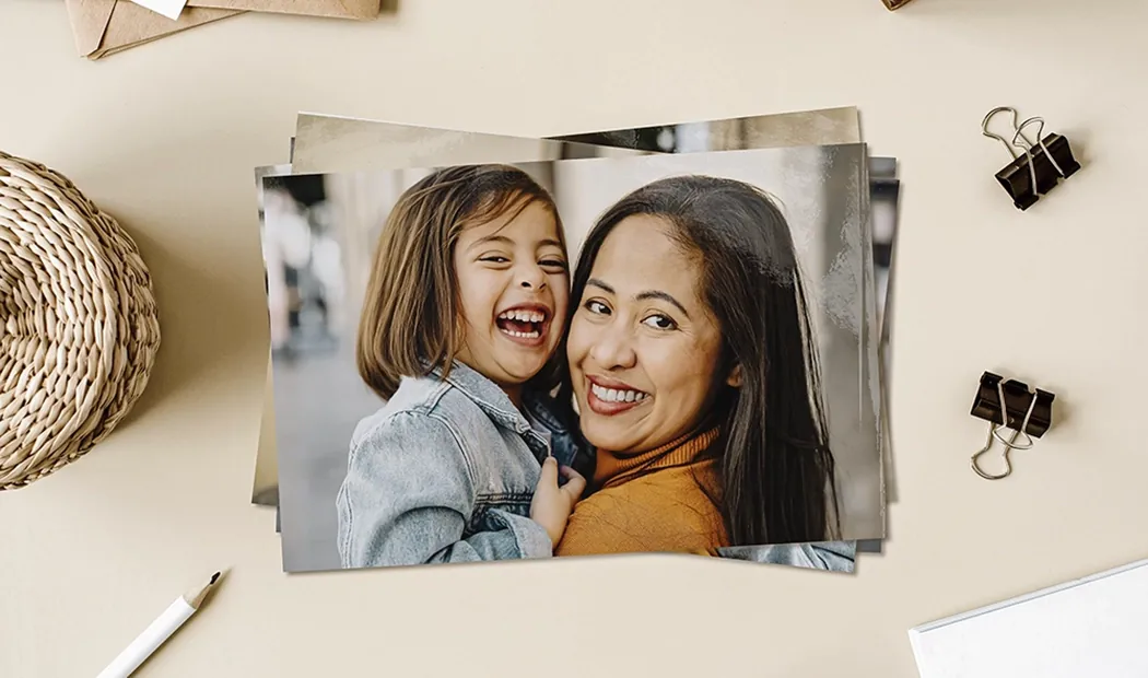 Stack of custom photo prints from the Printerpix online photo printing service