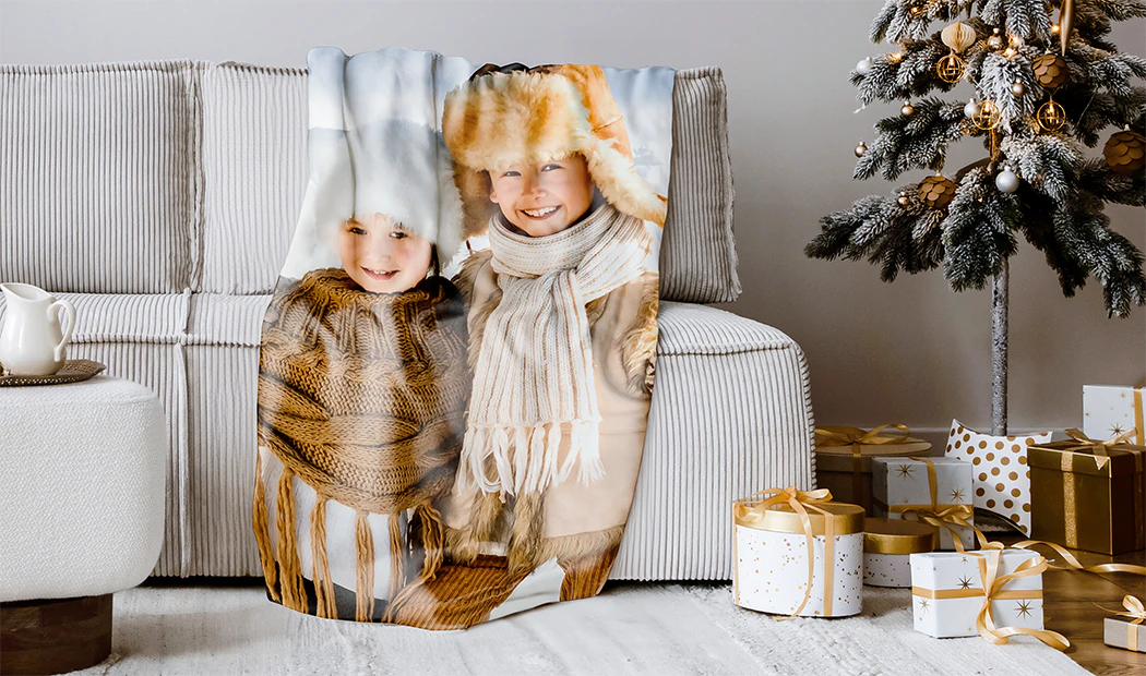 Mink Touch Photo Blanket by Printerpix|Personalised photo blanket: Mum and baby snuggle on a brown sofa. A unique, cherished keepsake.|Personalised fleece, cosy fleece, sherpa & woven layers. Luxury blanket with unique fringed edges.|Layers of fleece, cosy fleece, sherpa & woven fabric. Cosy, personalised comfort.|Soft fleece, cosy fleece, sherpa & woven fabrics stacked. Personalised comfort, your perfect texture awaits.|Personalised photo blanket: cherish memories, UK handmade. Fast shipping & free returns.|Cosy personalised photo blanket. Multiple sizes available. Features family photos in a festive design.|Personalised fleece blanket: premium fabric, high-definition print, fully customisable. Perfect gift!|Personalised mink & sherpa blankets: kids' faces printed on super-soft fabric. Unique gifts!||