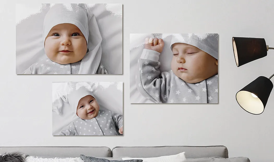 Small medium and large photo prints on table from mobile phone