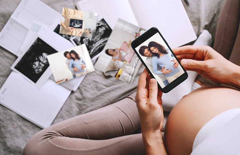 Small medium and large photo prints on table from mobile phone