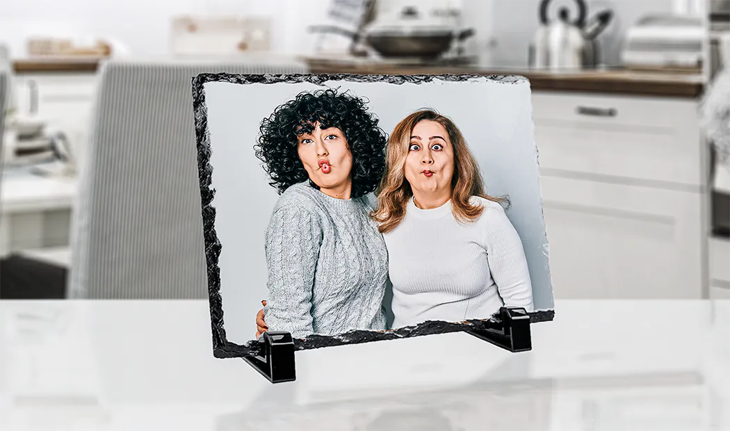 side view of stone slate with baby and mum and dad