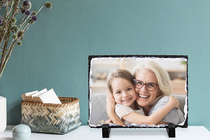 side view of stone slate with baby and mum and dad