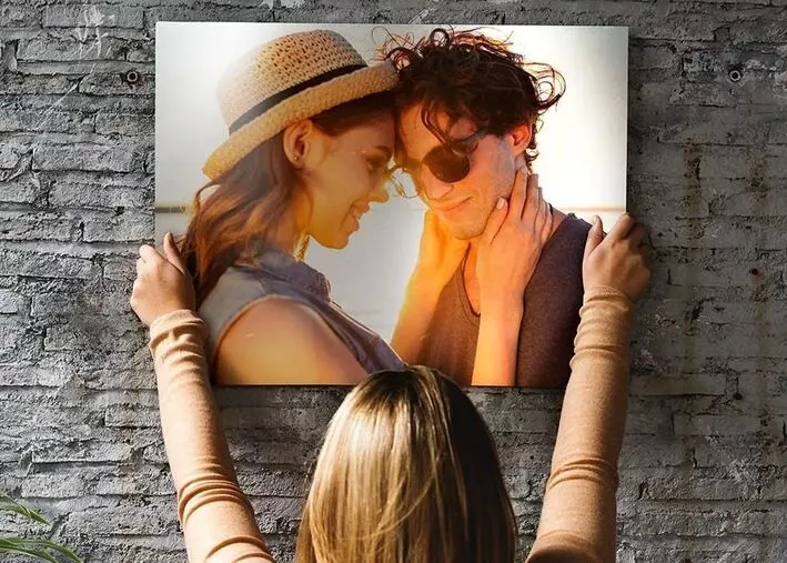 Metal photo print of mom and daughter on bookshelf