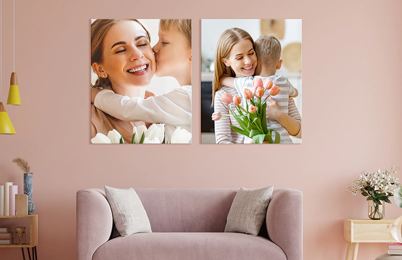 Woman placing metal print of girlfriend and boyfriend on wall
