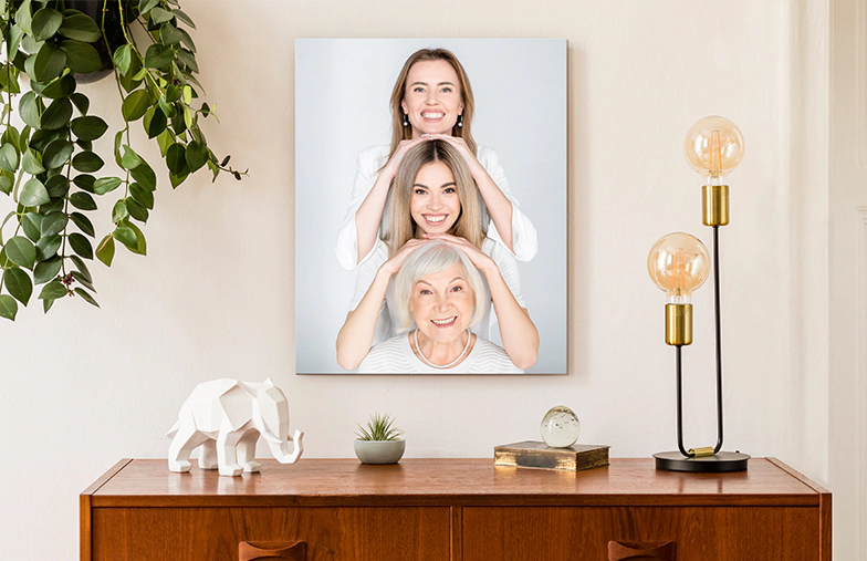 Three metal photo prints of mixed sizes